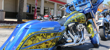 picture of a blue motorcycle with hydro dipped graphics on the body, hydro dipping custom motorcycle with yellow graphics 