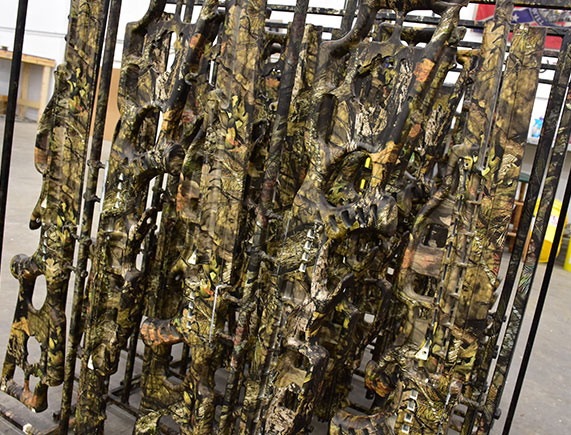 hydrographics, picture of a weapons rack that was dipped with camouflage hydrographics 